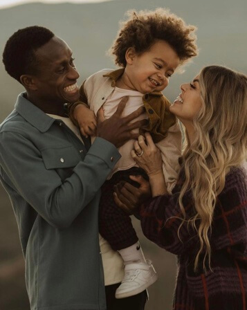 Melanie Pace with her husband, Richie Laryea, and their son.